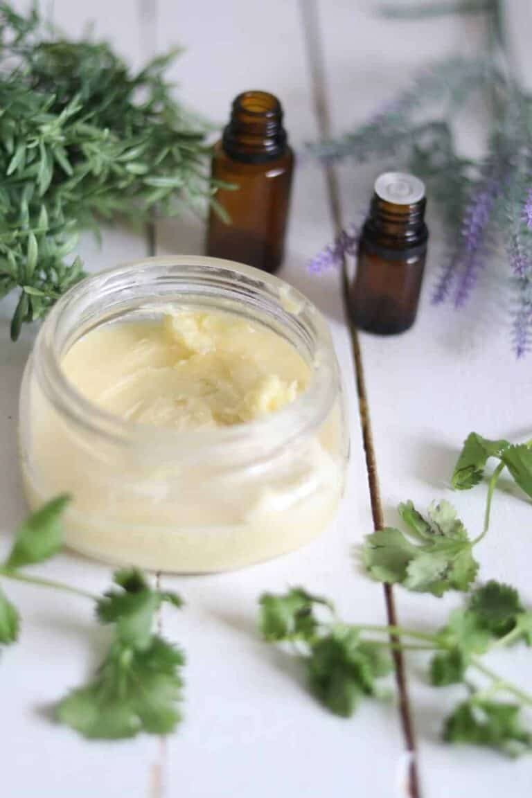 Items to reduce chlorine on a wooden slab table with decorative green leaves surrounding it.