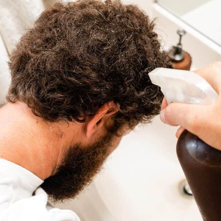 Spraying grey hairs with black tea.
