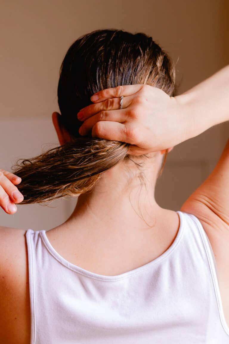 Working more of the hair mask onto the tips of our hair.