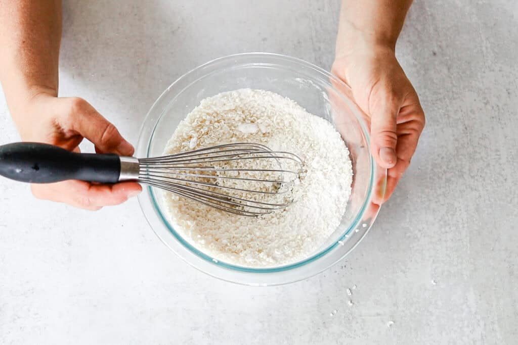 Whisking the dry ingredients together with the vinegar.