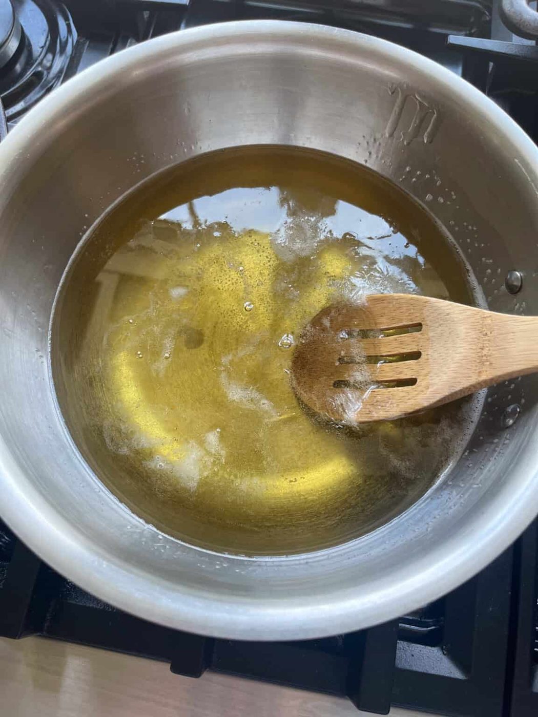 Melted soap base in a pot.