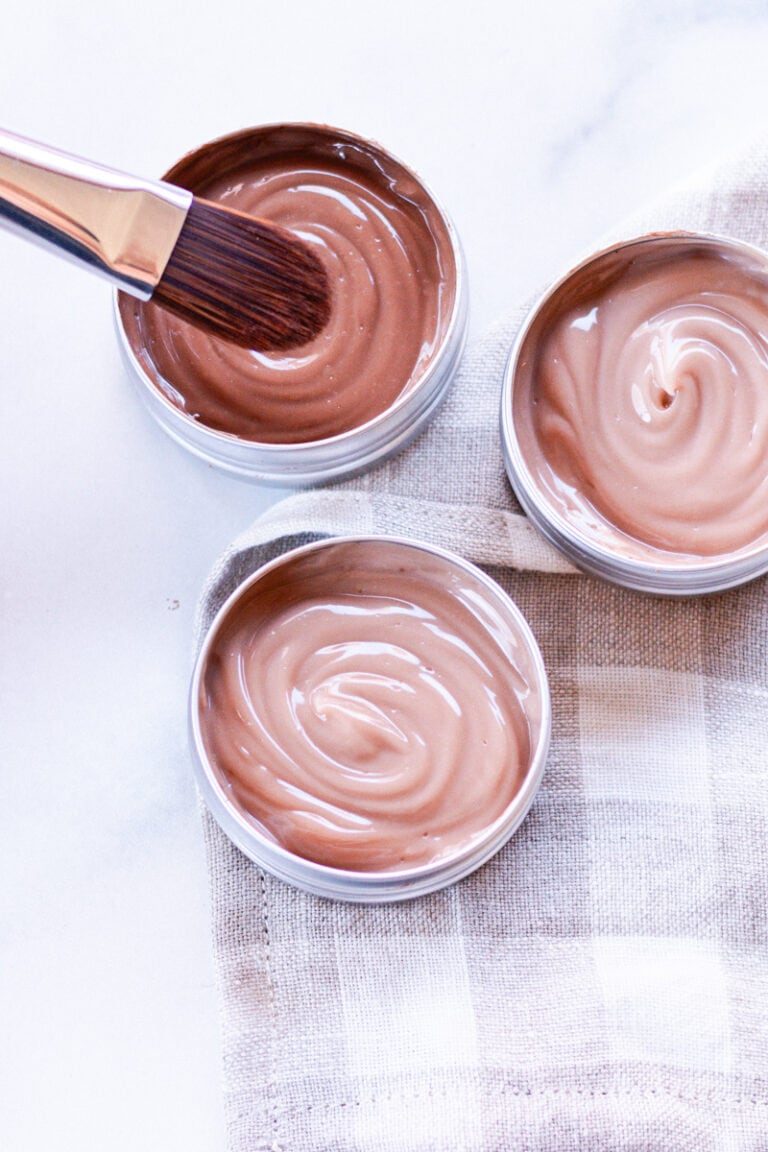 Dipping our foundation brush into our homemade liquid foundation.