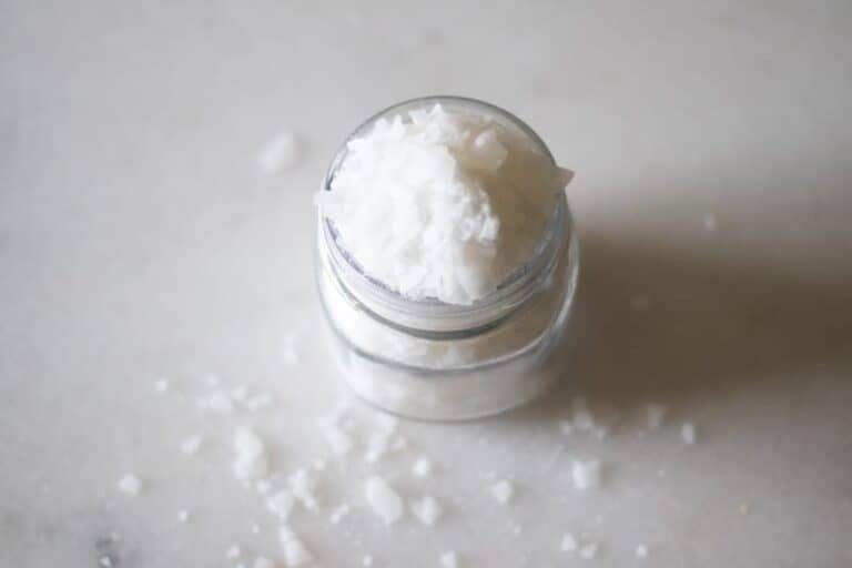 magnesium flakes in mason jar on white marble