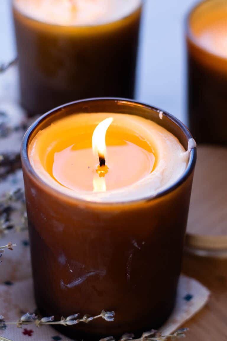 A homemade massage candle flickering in the evening light.