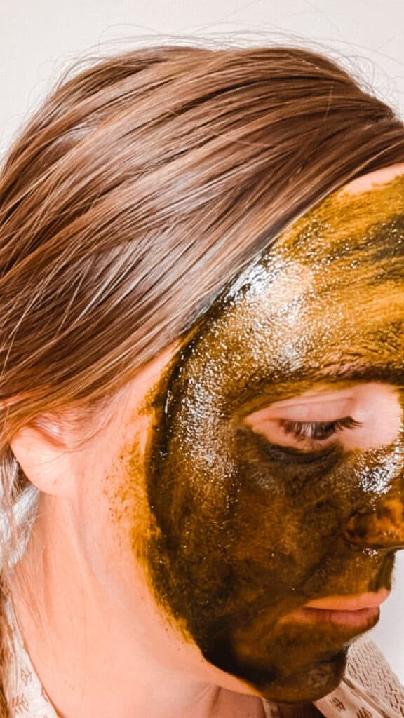 Applying matcha face mask to the skin.