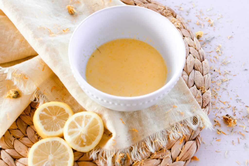 A bowl of all natural nail soak.