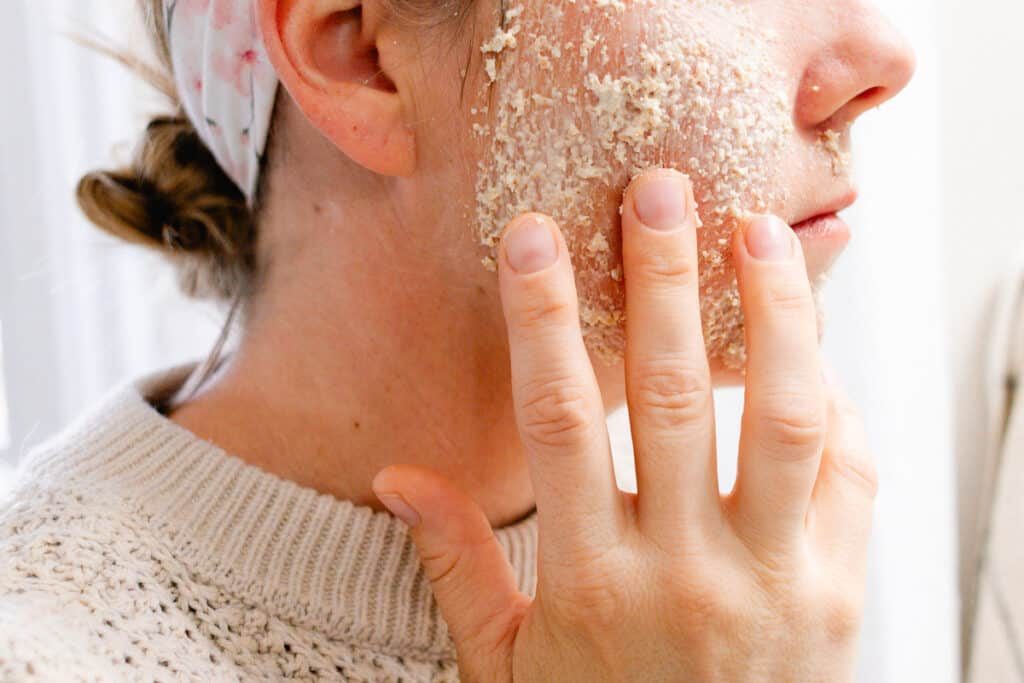 Applying oatmeal face mask to our face.