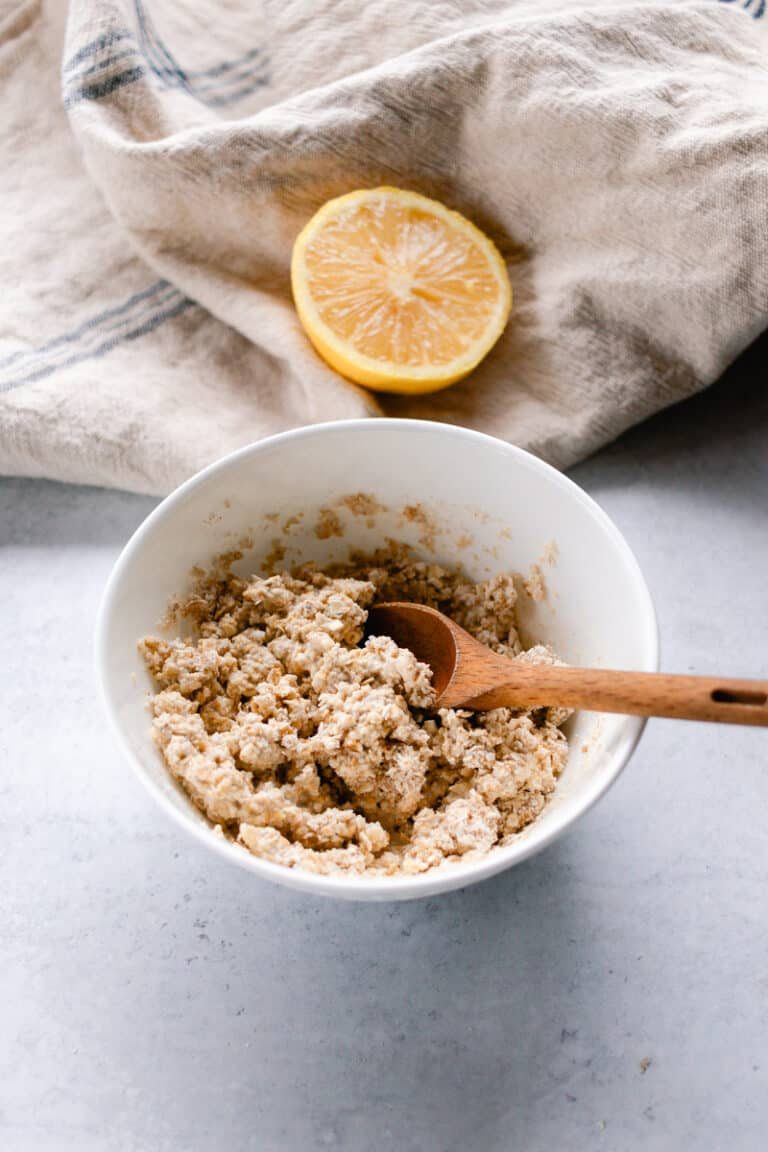 Our oatmeal lemon face mask being scooped up to apply to our face.