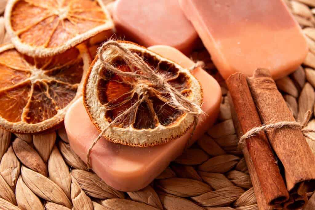Orange vanilla soap with a dried orange slice tied to the top with hemp string.