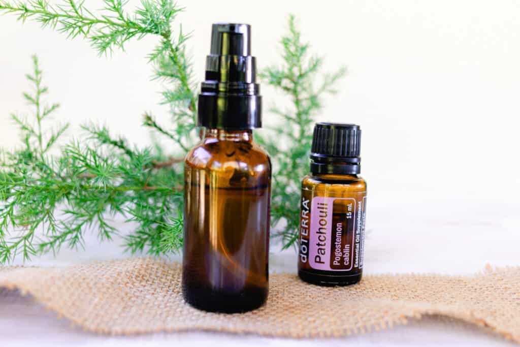 DIY patchouli cologne in a glass spray bottle.