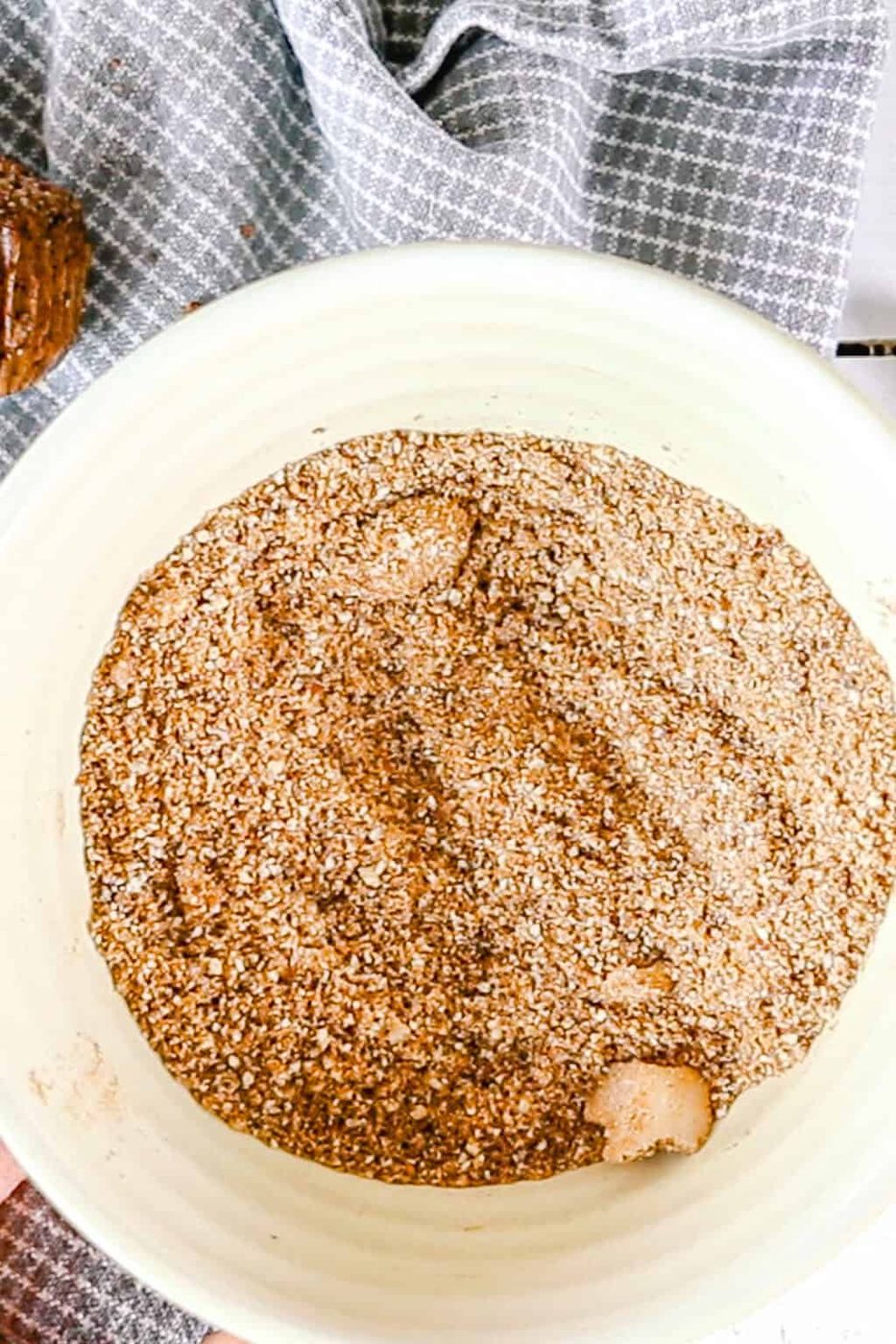 Crumble ingredients to top the muffins with are being combined in a small bowl.