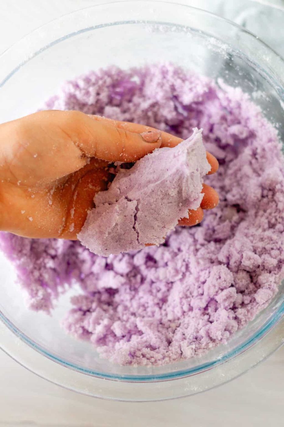 Squeezing the ingredients in the palm of our hand to check the texture.