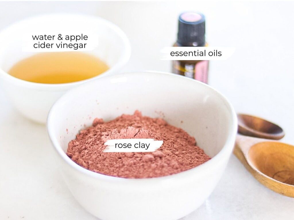 Rose clay face mask ingredients labeled on a white counter.