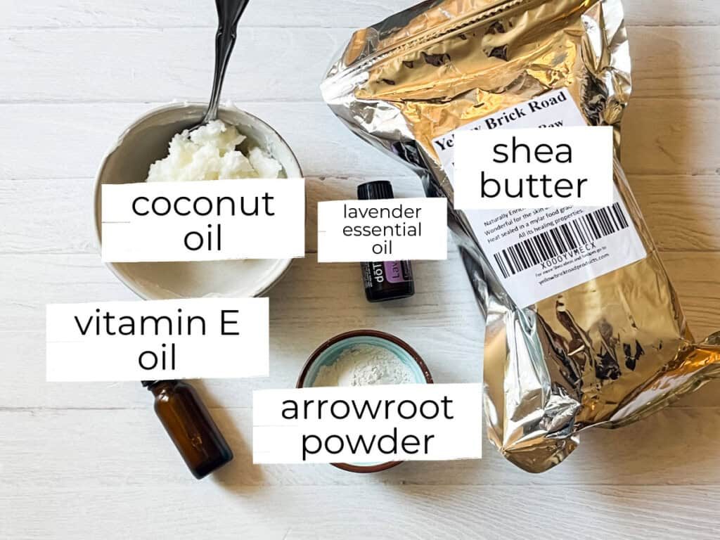 Shea butter lotion ingredients labeled on a white table.