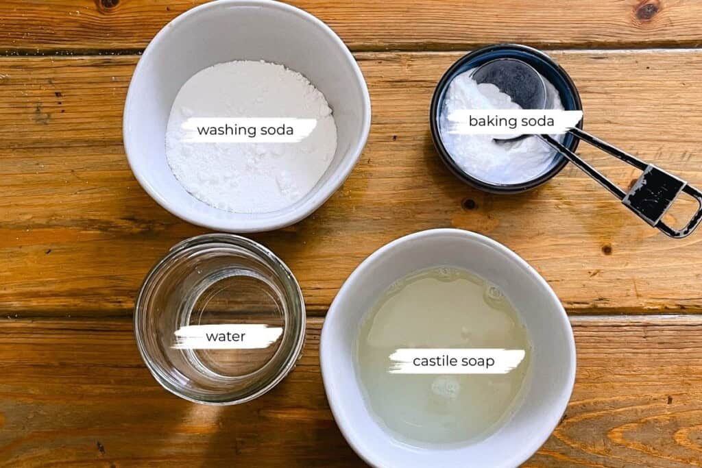 Homemade laundry detergent ingredients on a wooden table.
