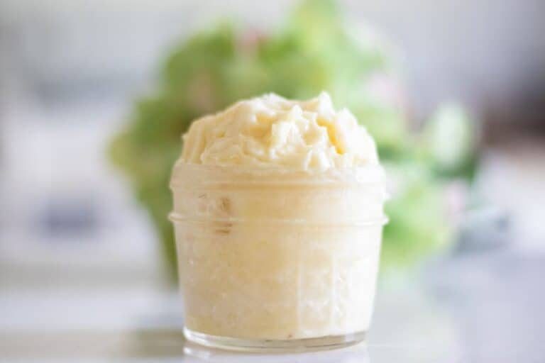 Homemade after sun lotion in a glass container.