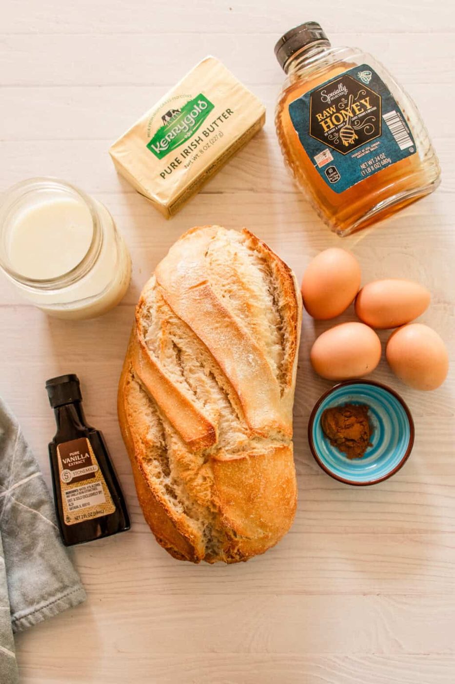 Sourdough french toast ingredients on a white backdrop.