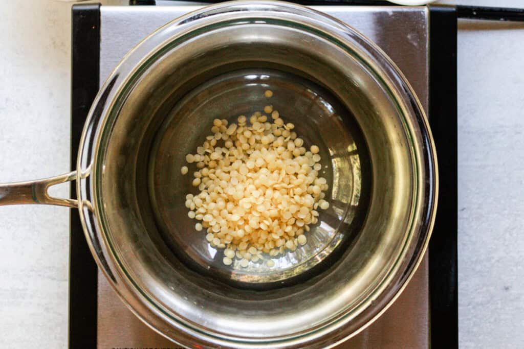 Melting tallow balm ingredients in a double boiler.