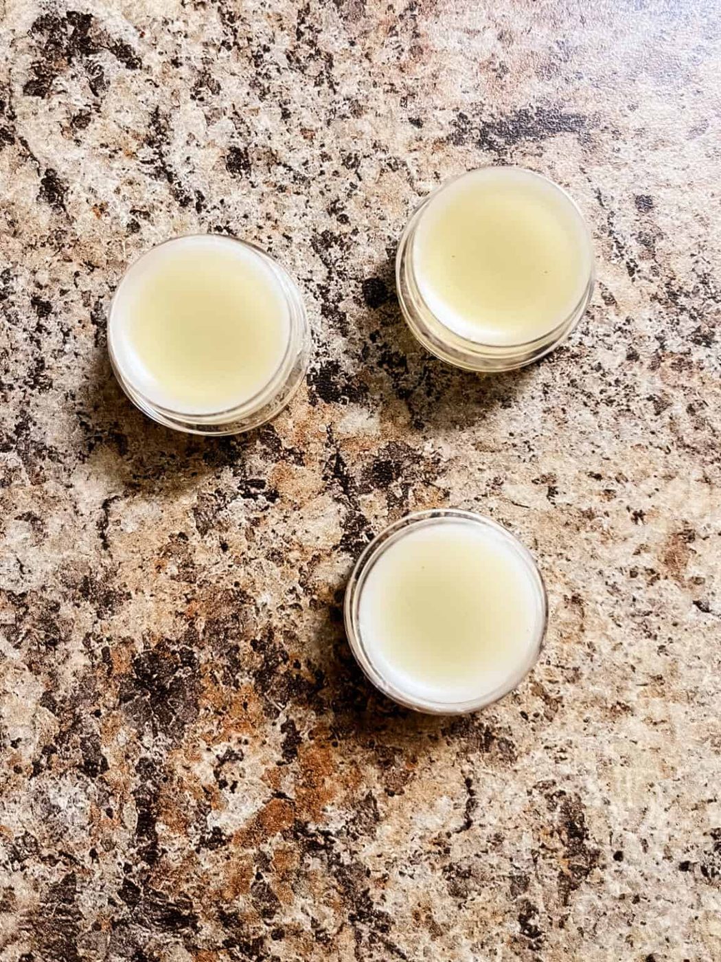 Tallow lip balm in lip balm containers.