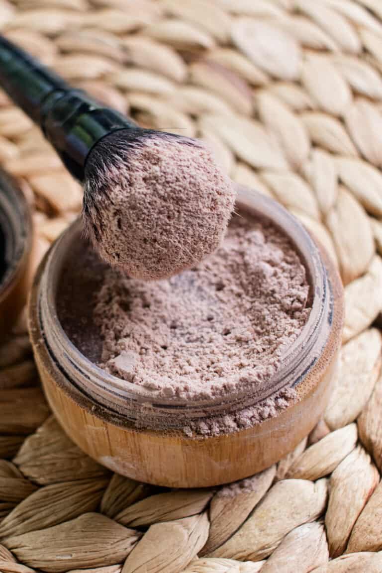 Dipping a brush into dry shampoo.