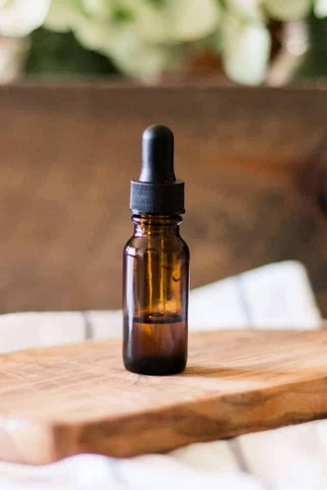Bottle of vitamin E oil with black dropper top.