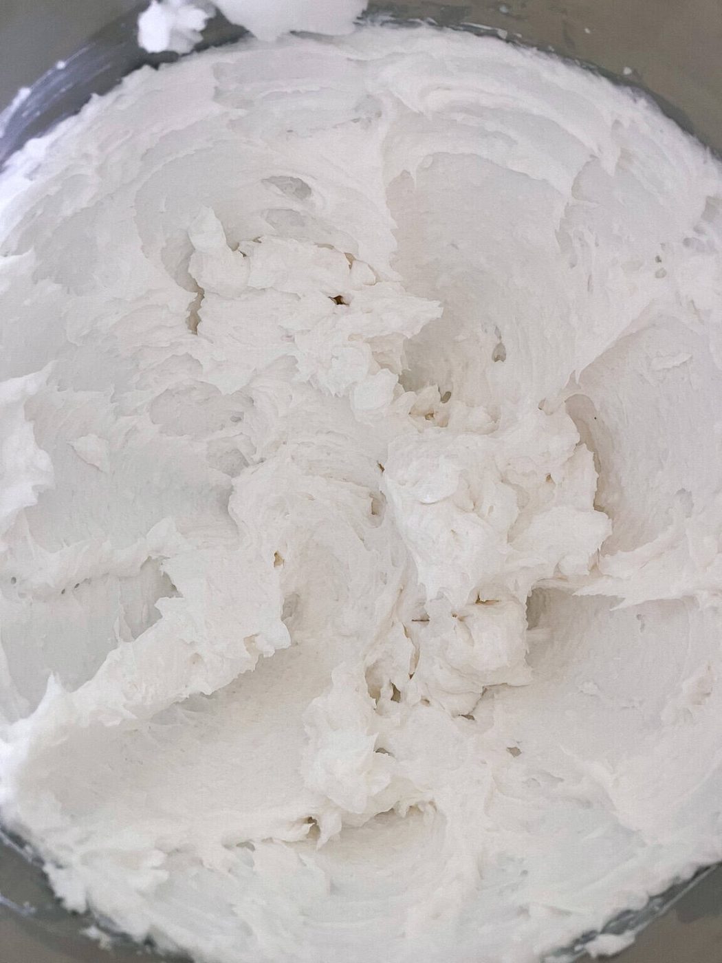 Whipped soap base in a mixing bowl.