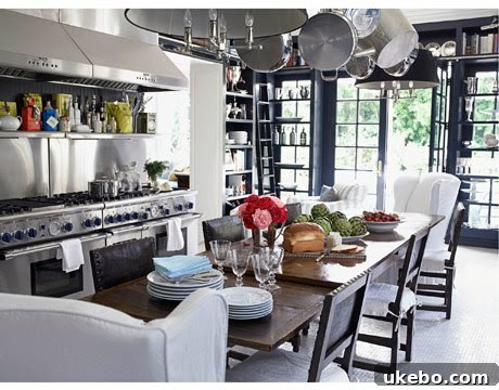 Compact kitchen design with dining table as centerpiece