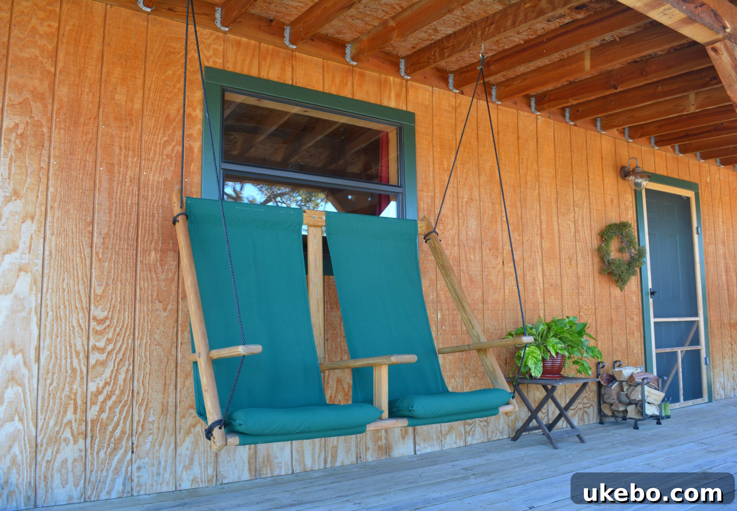 The exterior of Pamela's small home, blending into the New Mexico mountain landscape with rustic charm