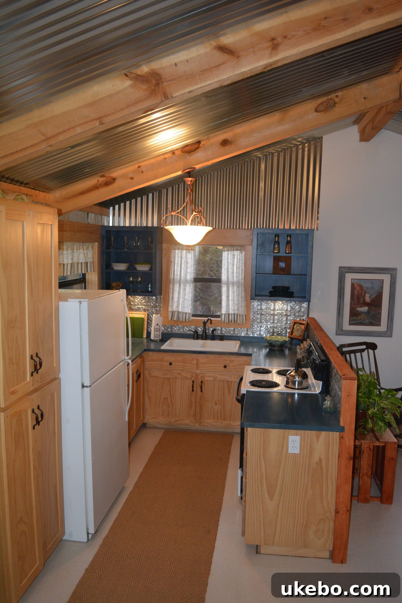 Another view of the cozy living area, highlighting natural light and thoughtful decor