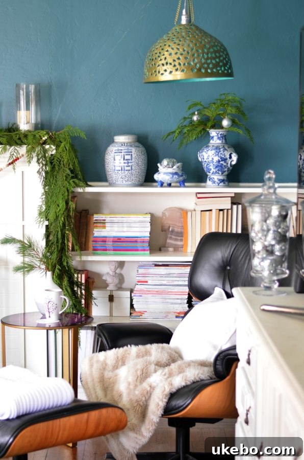A charming corner display showcasing natural holiday decorations and deep wall colors