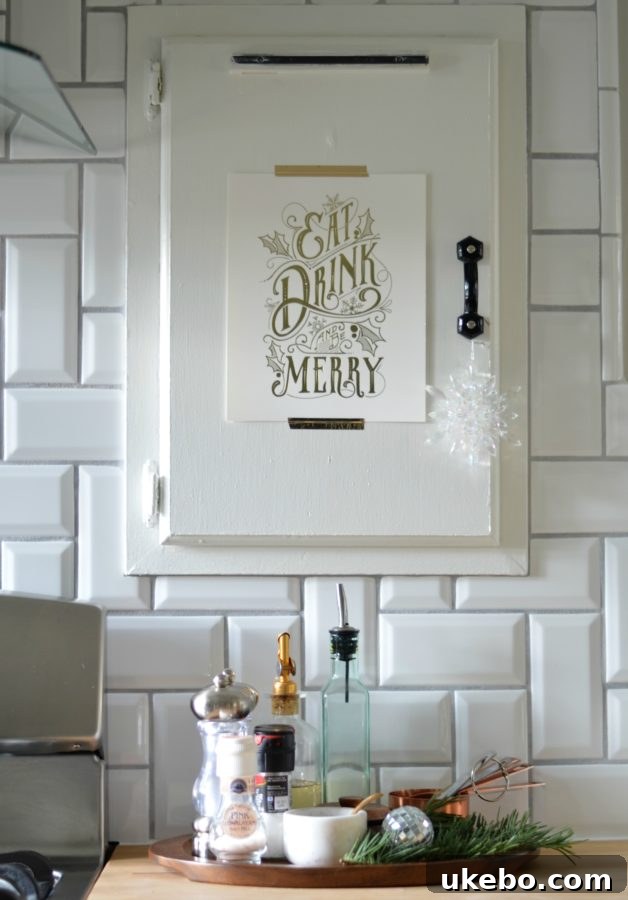 Organized spice cubby with a delicate sprig of holiday greenery for a festive touch