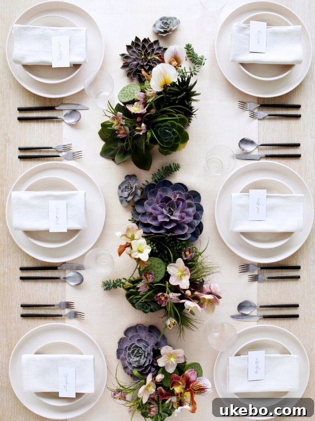 Elegant dining room with a long table, ready for a formal meal.