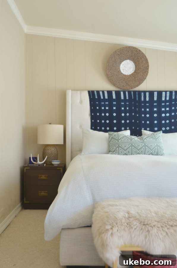 Bedroom featuring African mudcloth textile, inspiring Shibori choice.
