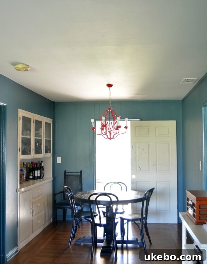 Our current dining room showing the awkward layout and existing furniture