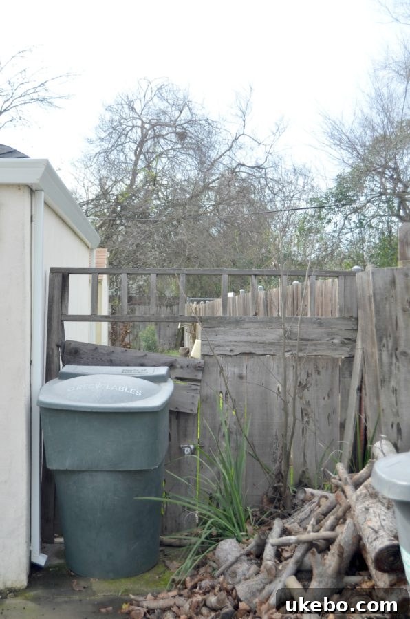 A gate that no longer closes properly, with rotting wood and missing hardware, posing an open invitation to unwanted visitors.