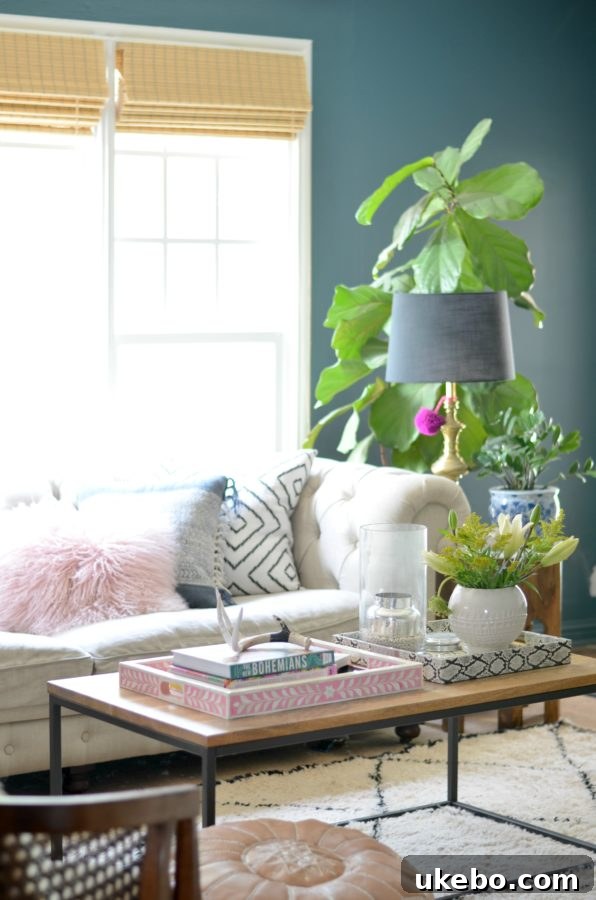 A different angle of the living room, highlighting a cozy seating arrangement with vintage finds and global textiles.