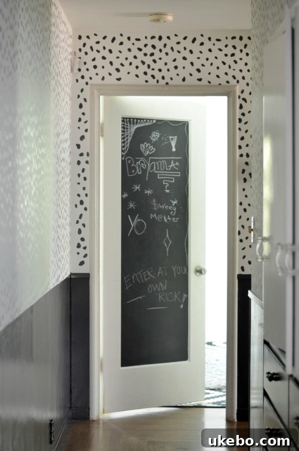 Current look of the hallway with dalmatian print wallpaper