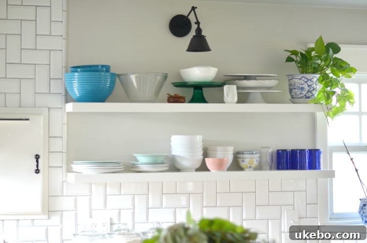 Kitchen sink area with new pendant light and natural light