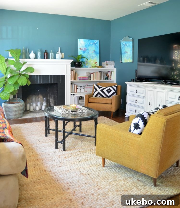 First fireplace renovation featuring black painted brick, new moldings, and marble subway tile hearth, with Fiona as a toddler