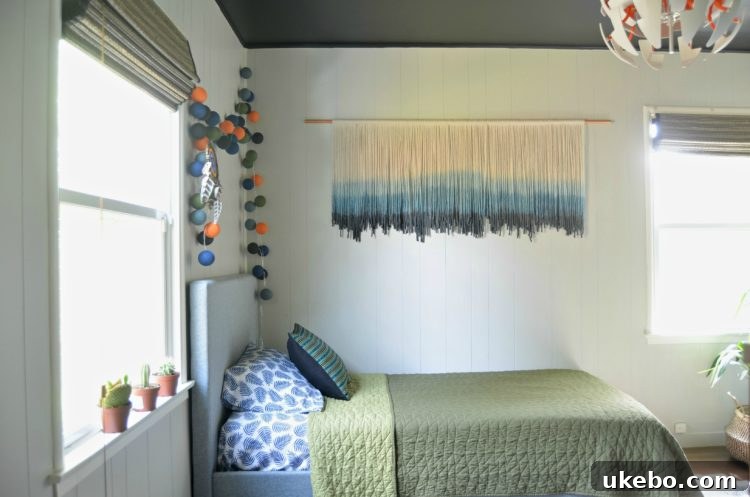 Wide shot of the boy's room with new bed, walls, and ceiling in place
