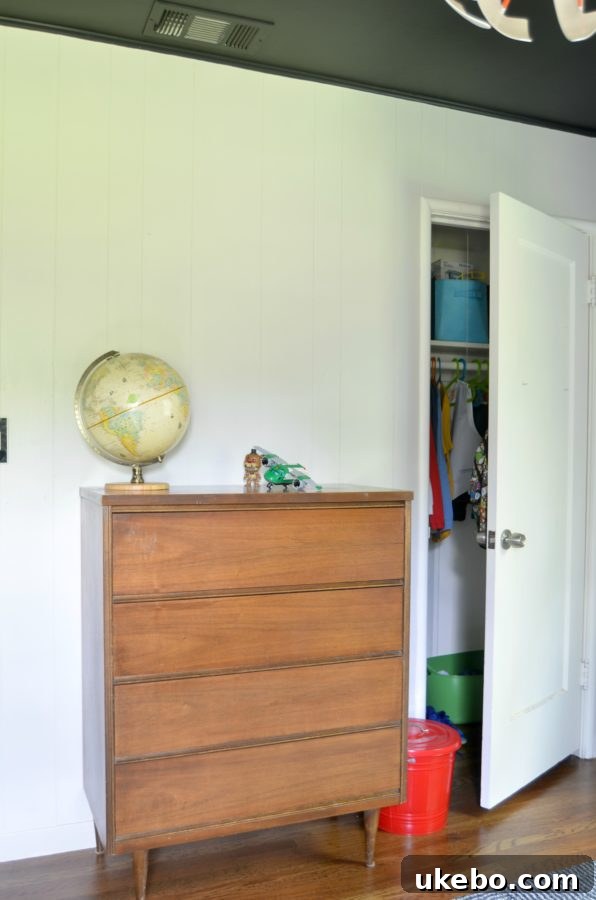 View of the window with new bamboo shades and grey walls