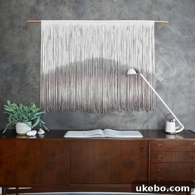 Intricate macrame wall tapestry by Boho By Lauren, featuring detailed knot work and a flowing design in a natural color palette.