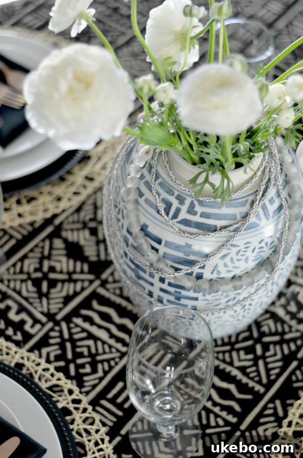 Detail of copper flatware on mudcloth tablecloth