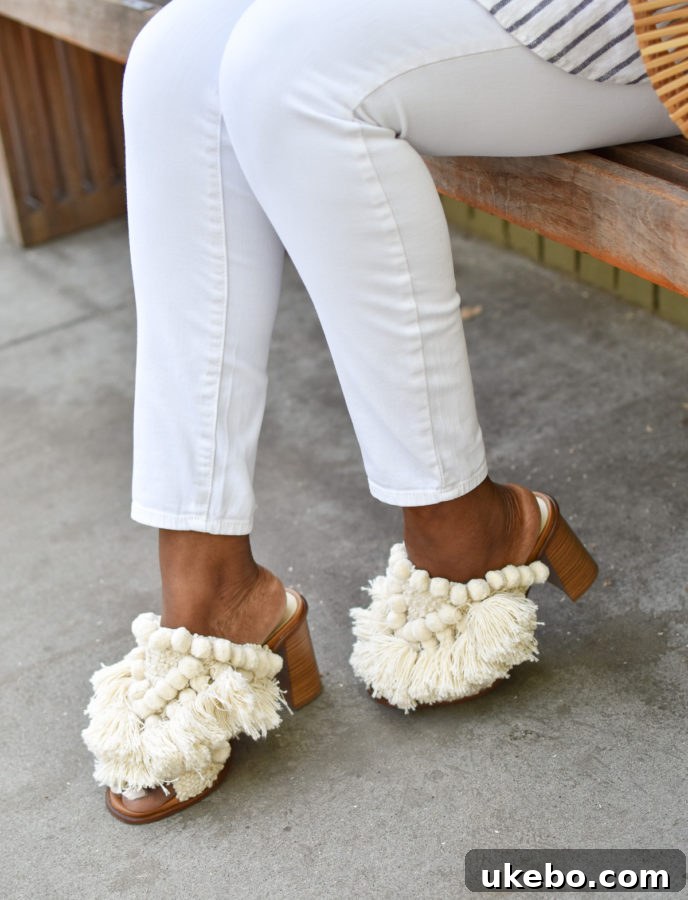 Detailed view of the stylish Zara pom pom tassel mules, a comfortable and chic footwear choice