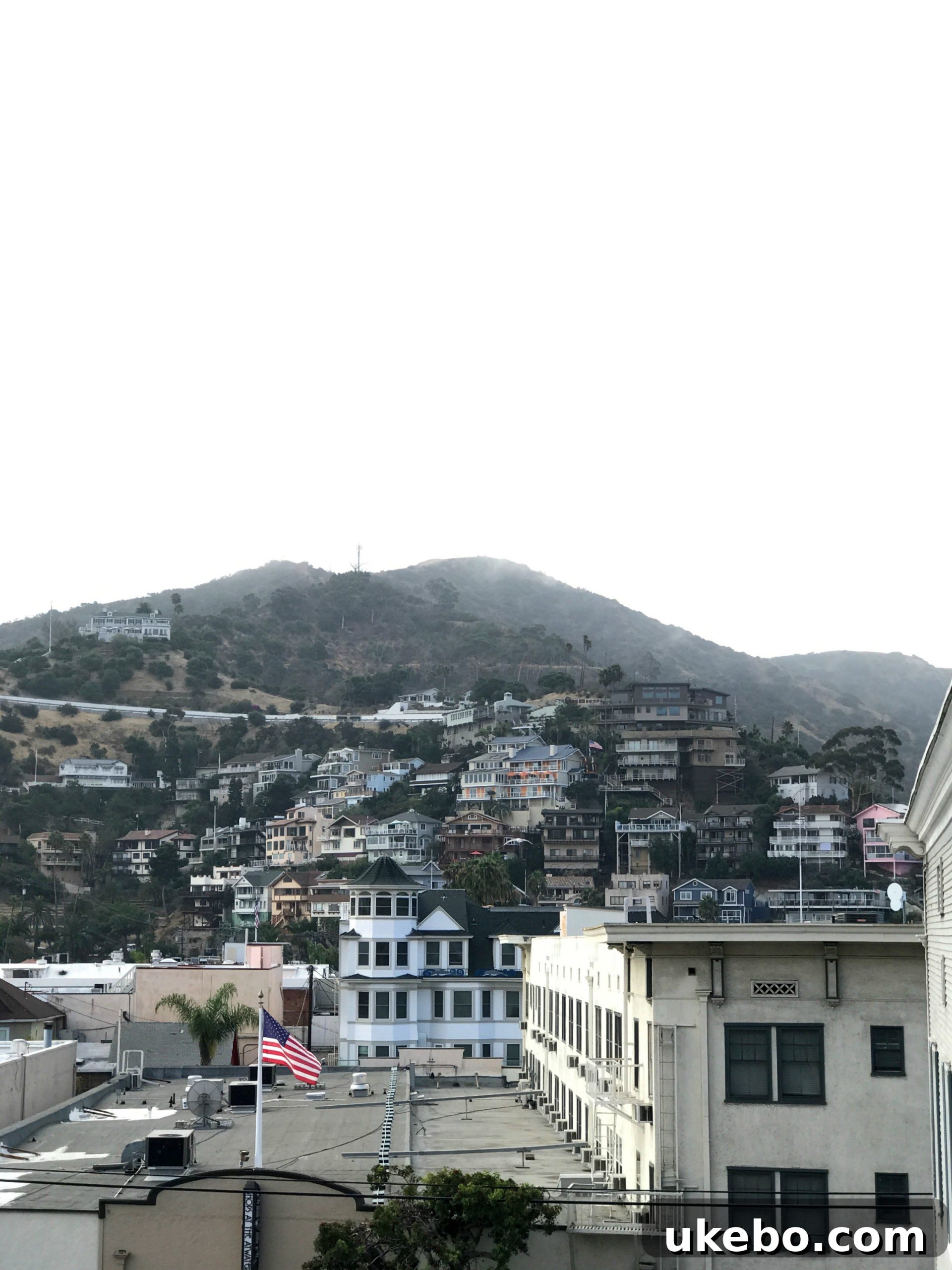 Couple relaxing on the balcony of their hotel room at Catalina Island Inn