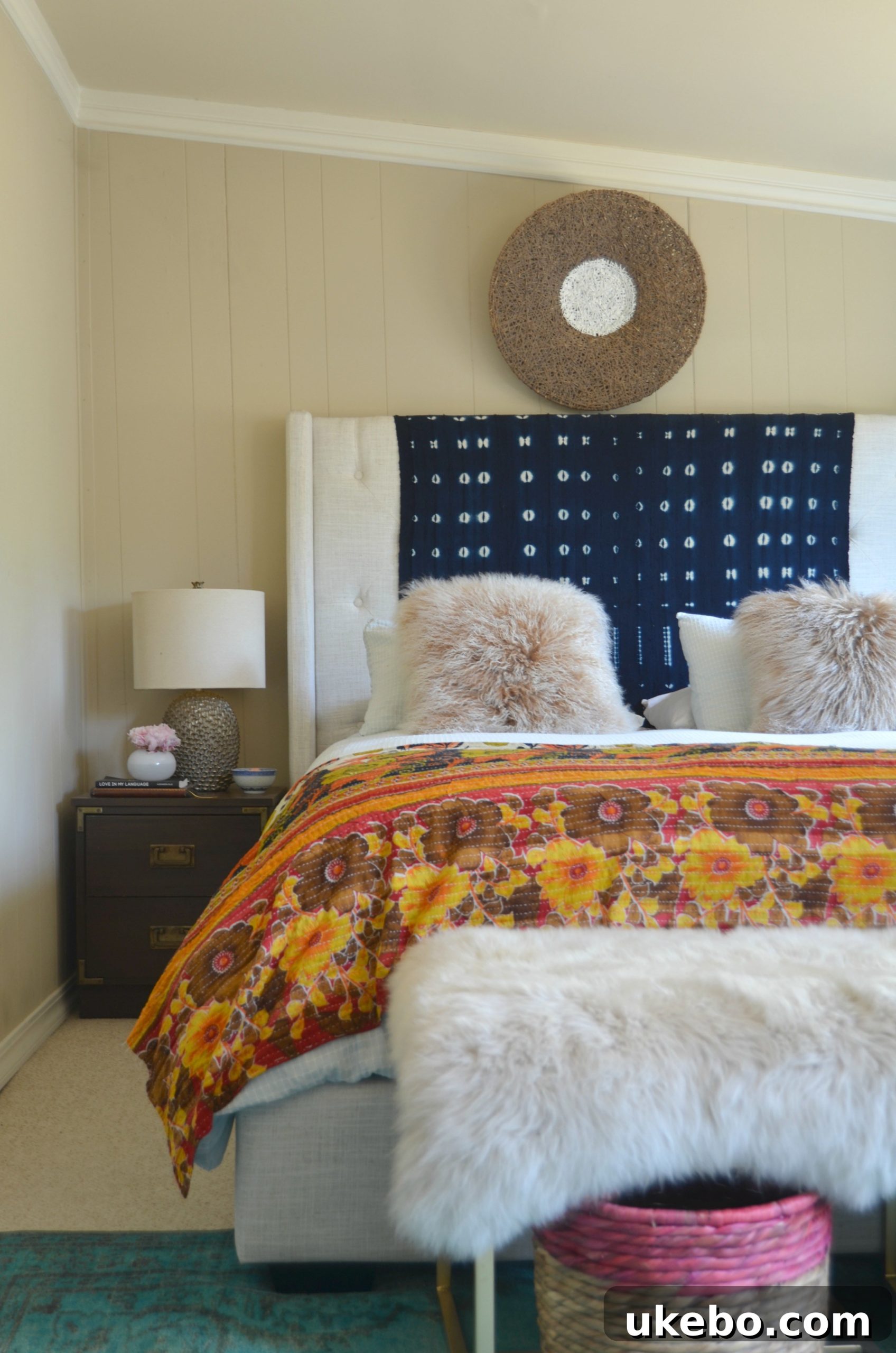 View from a doorway into a functional, smaller room currently used as a bedroom, showing practical decor
