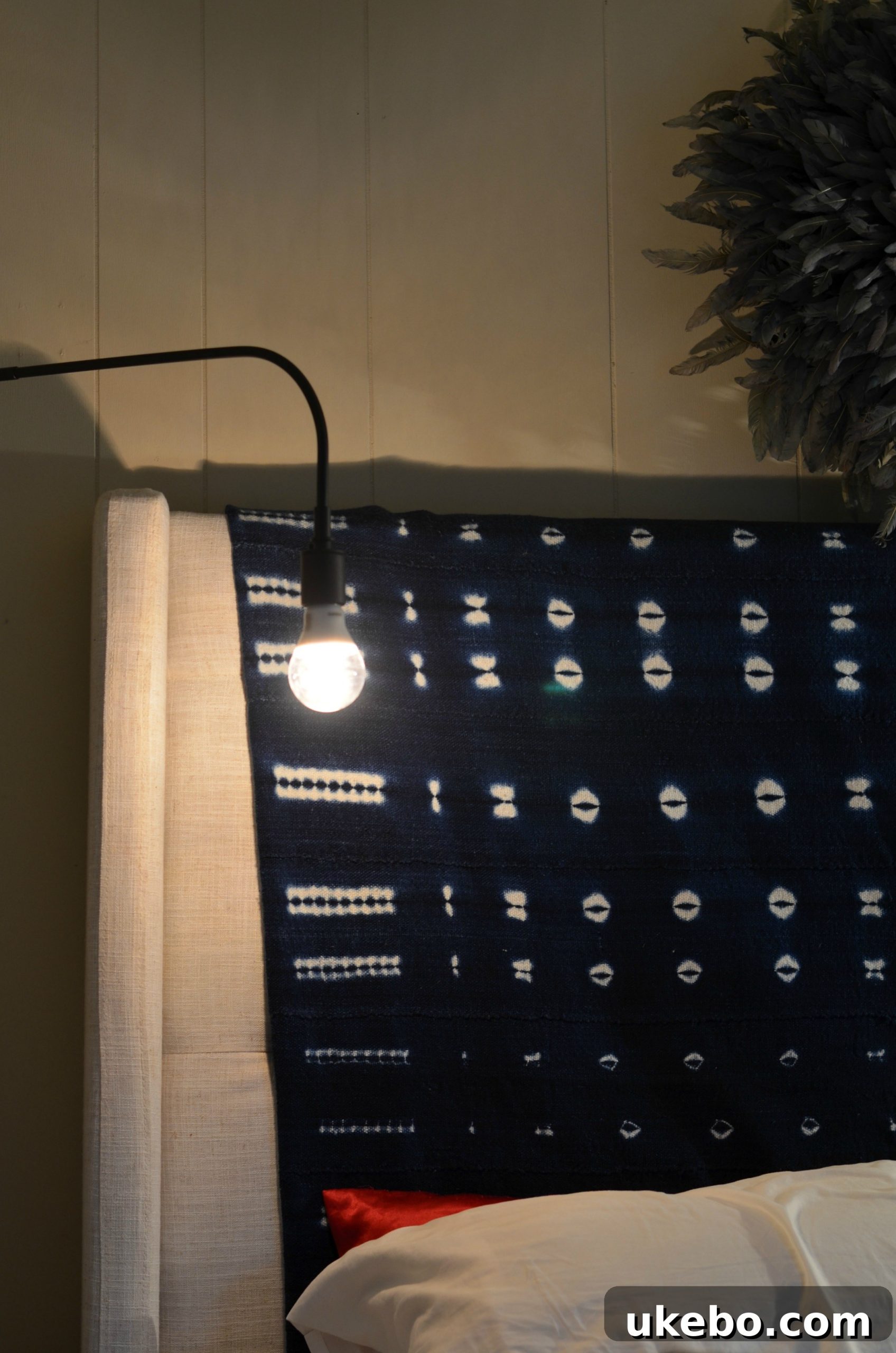 Focus on the sconce's adjustable head, perfect for focused reading light at night.