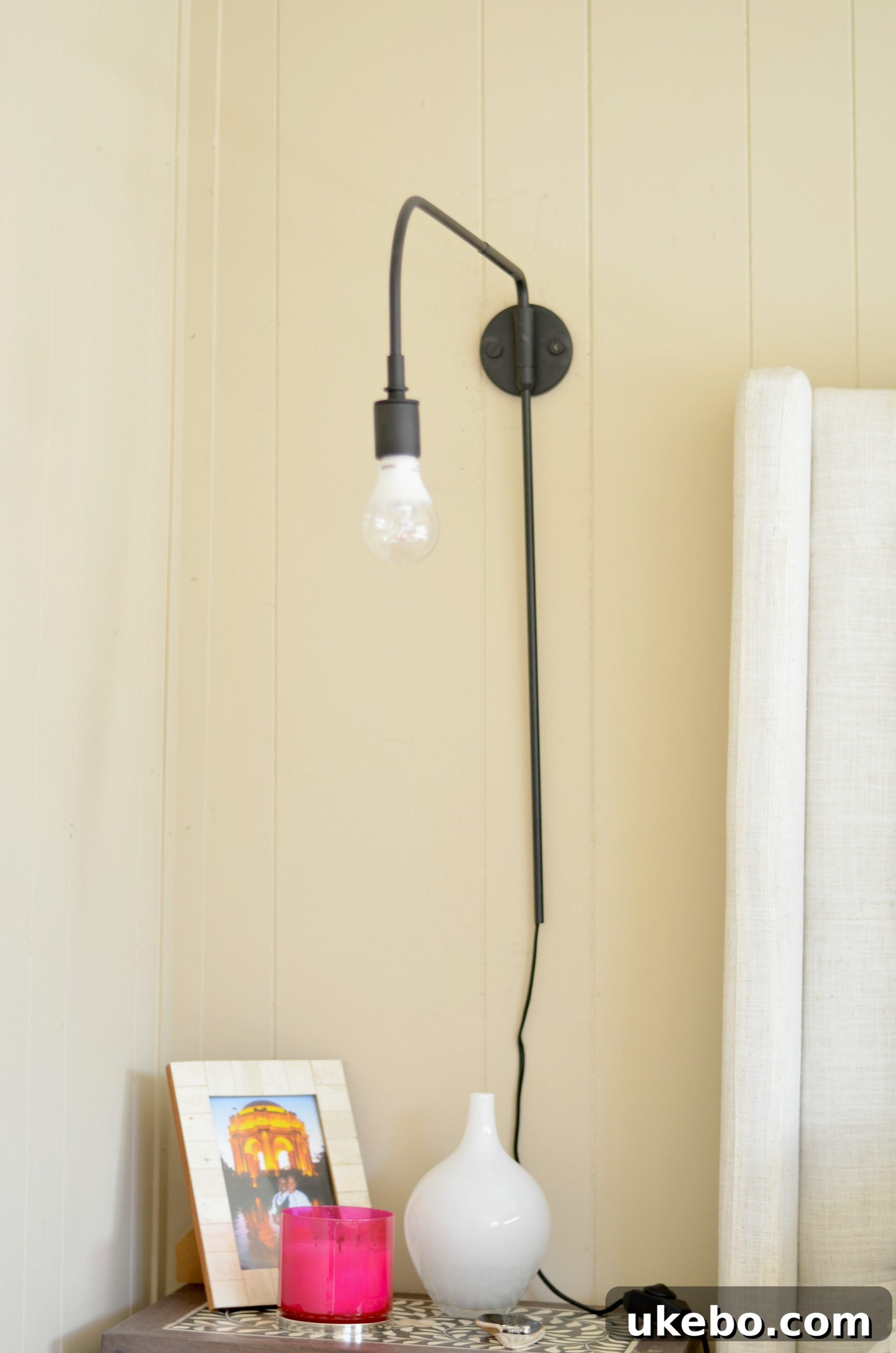 A different angle highlighting the minimalist appeal of the new bedside lighting solution, blending seamlessly.