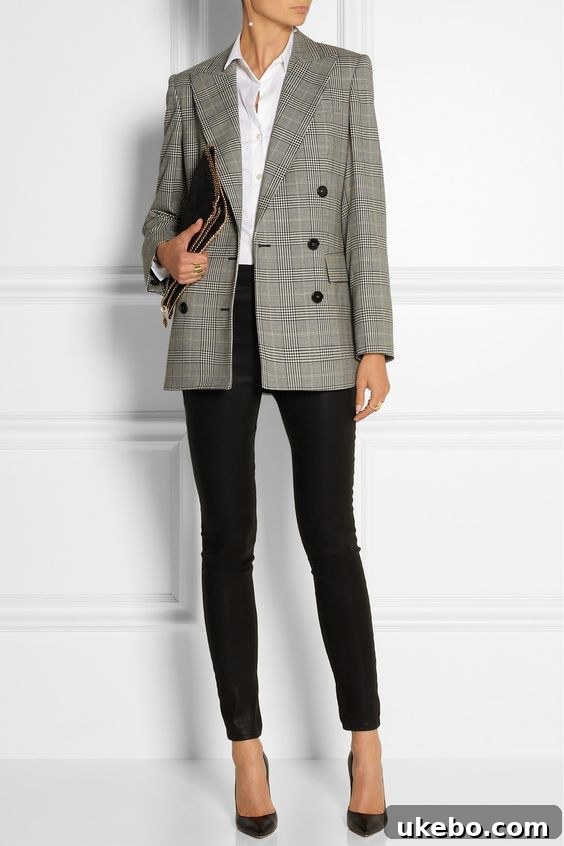 Woman confidently wearing a Prince of Wales check blazer