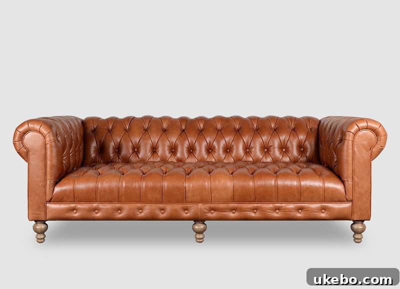 Tan Leather Sofa A Design Muse 13 Roger and Chris Higgins Chesterfield Sofa, a classic and robust Chesterfield design in rich brown leather, offering deep tufting and rolled arms.